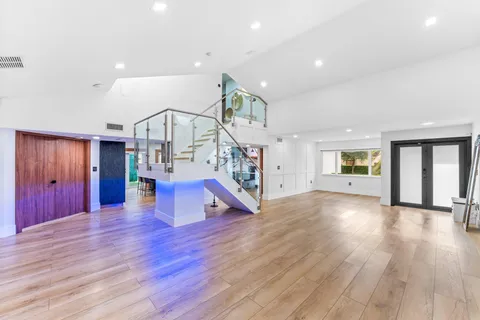a view of an entryway with wooden floor