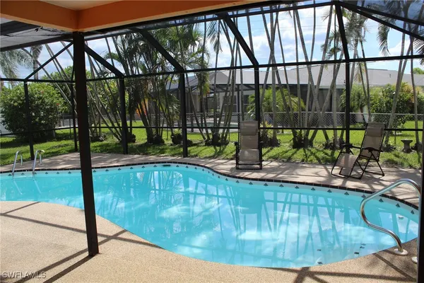 a view of a swimming pool with a patio