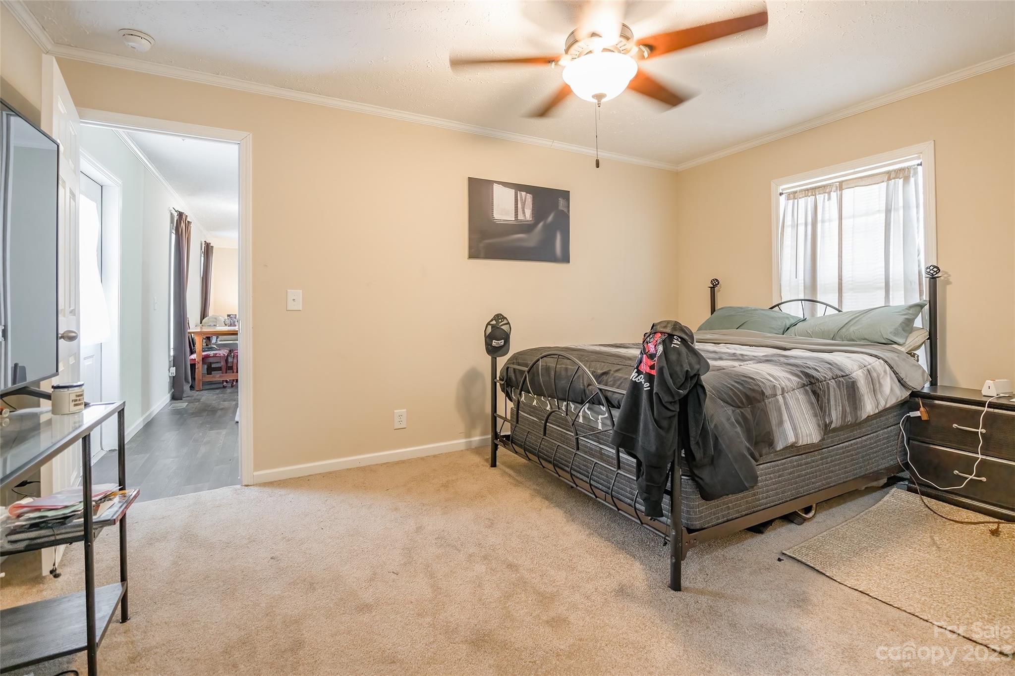 2168 Mission Road York, SC 29745 - Photo 8 of 19 a bedroom with a bed and a chandelier