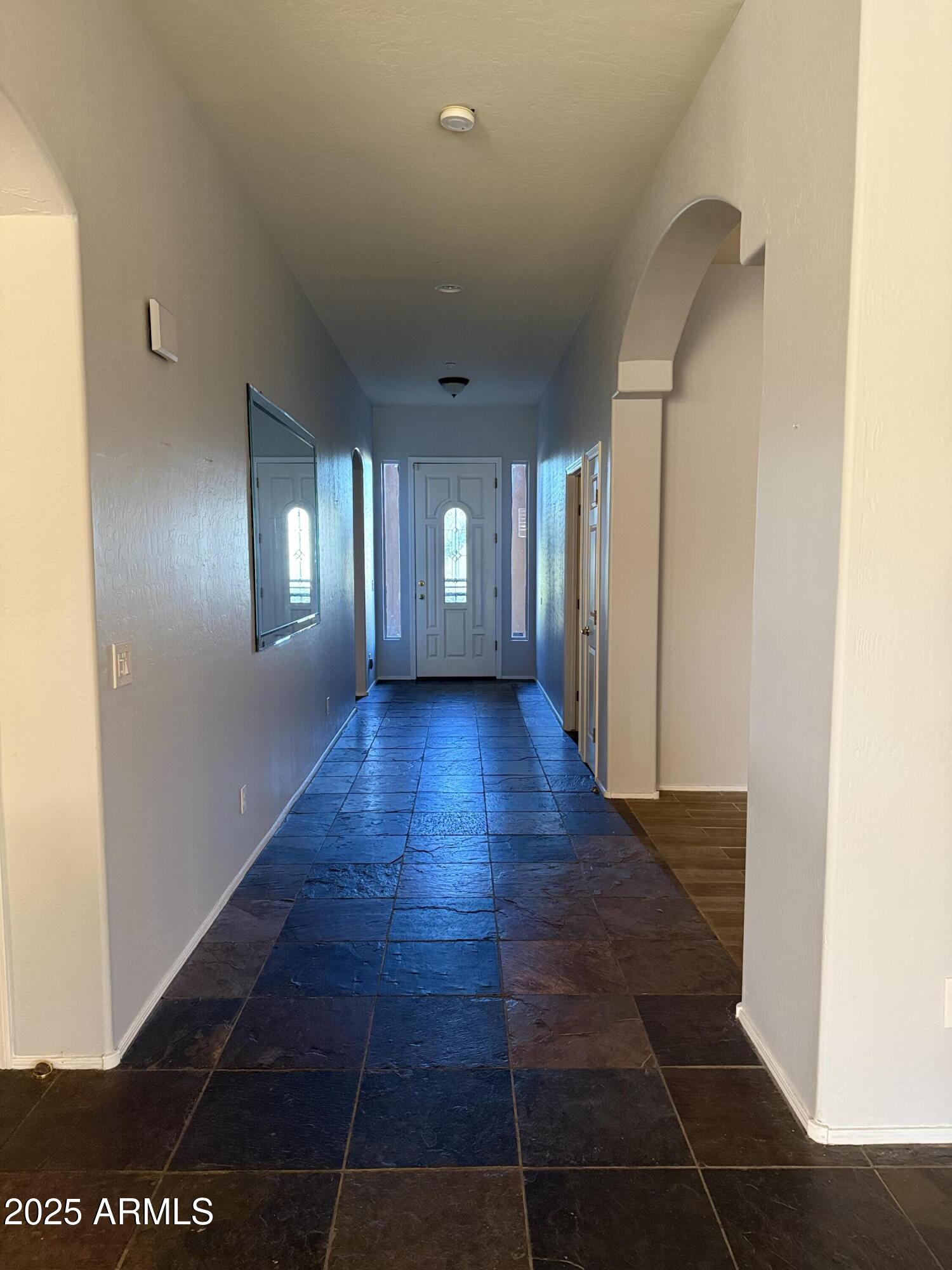 10453 East Pine Valley Drive Scottsdale, AZ 85255 - Photo 18 of 35 a view of an empty room with glass door