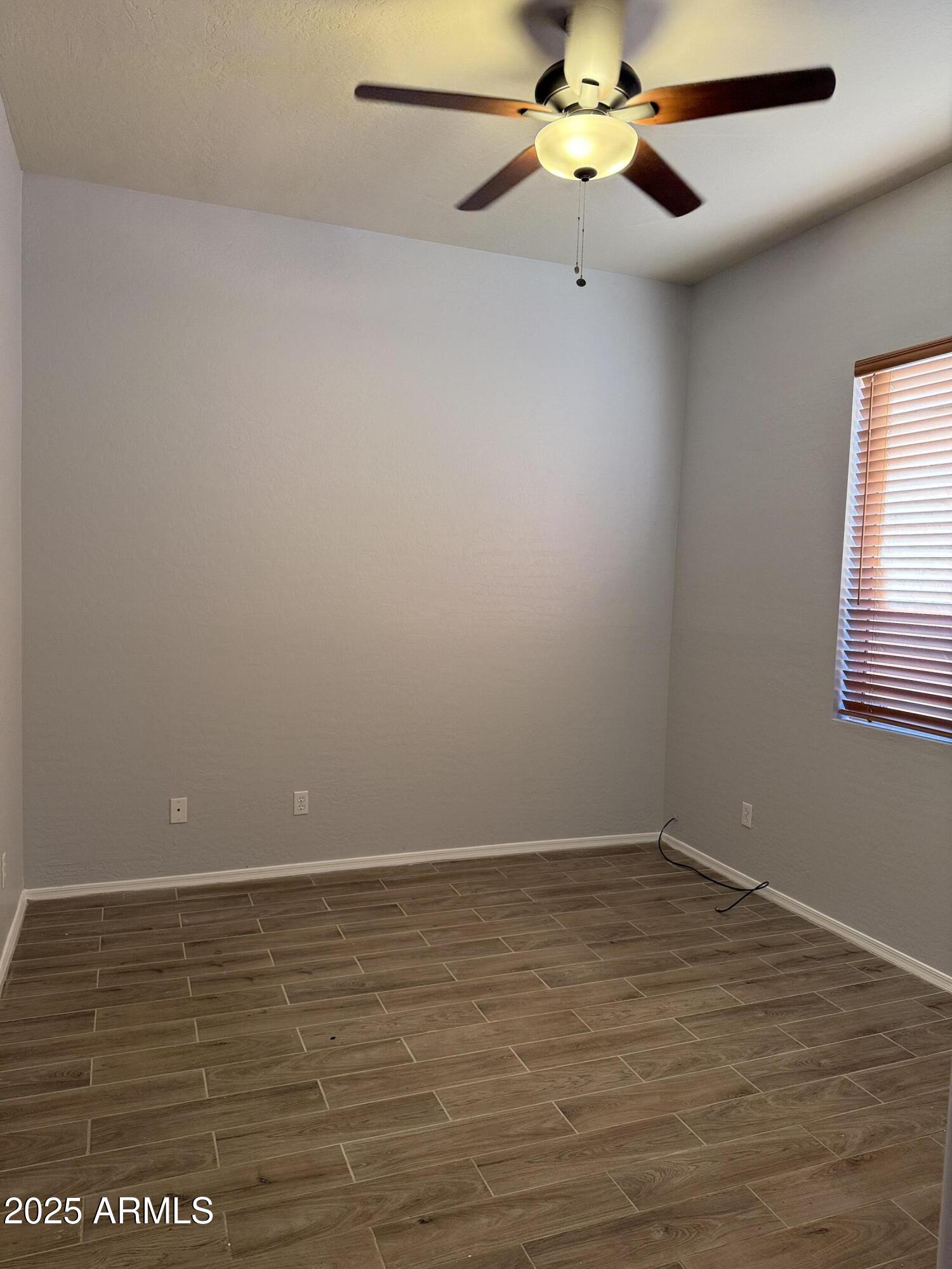10453 East Pine Valley Drive Scottsdale, AZ 85255 - Photo 28 of 35 a view of an empty room with a window