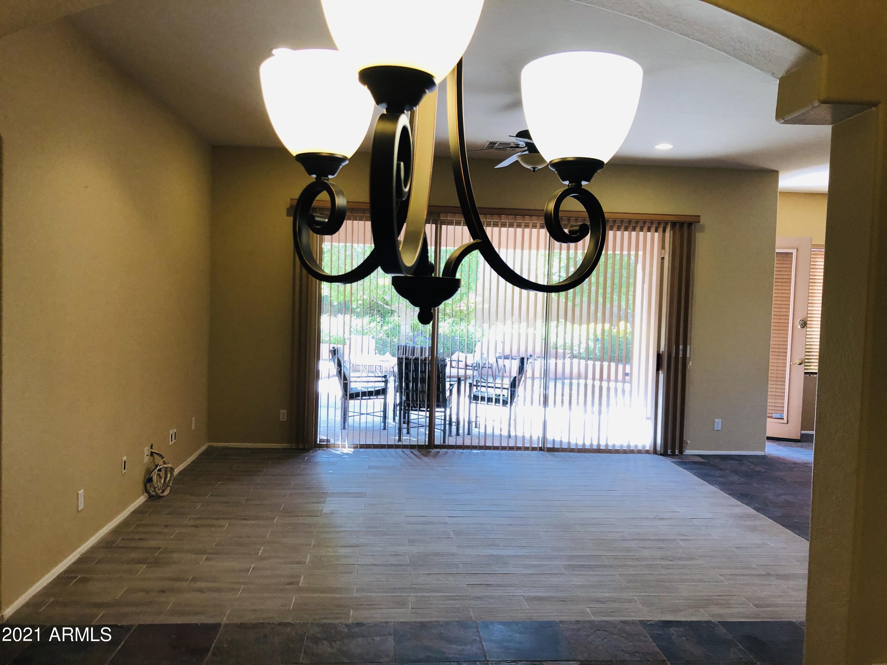 10453 East Pine Valley Drive Scottsdale, AZ 85255 - Photo 5 of 35 a view of fireplace and wooden floor