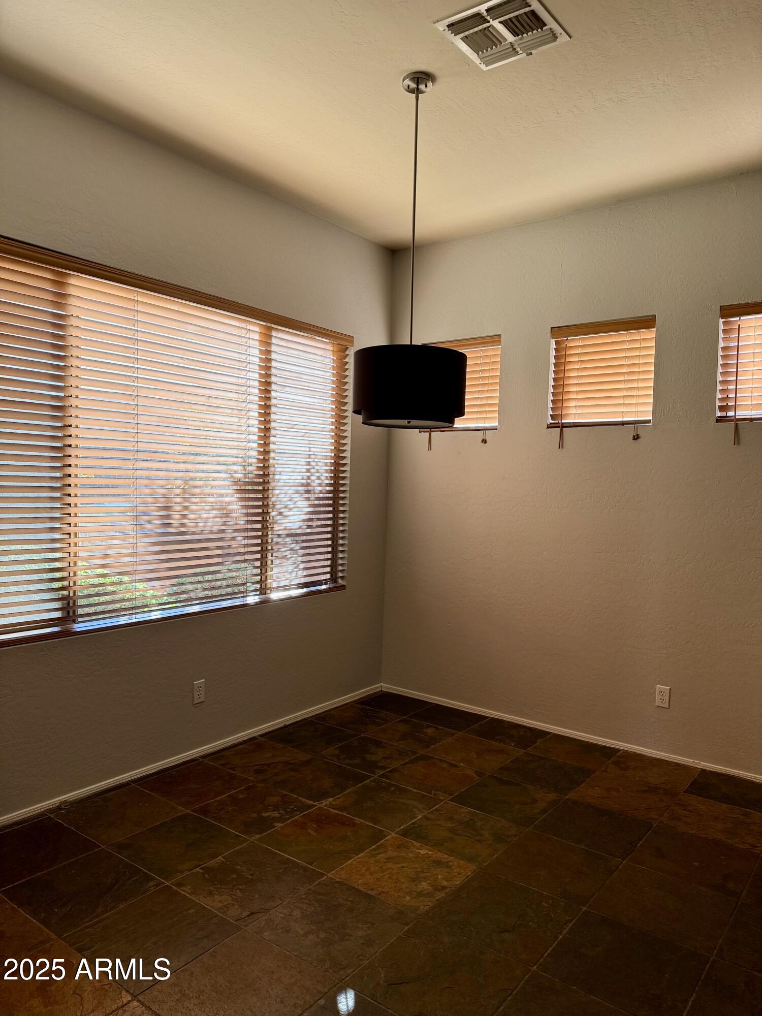 10453 East Pine Valley Drive Scottsdale, AZ 85255 - Photo 6 of 35 a view of an empty room with a window