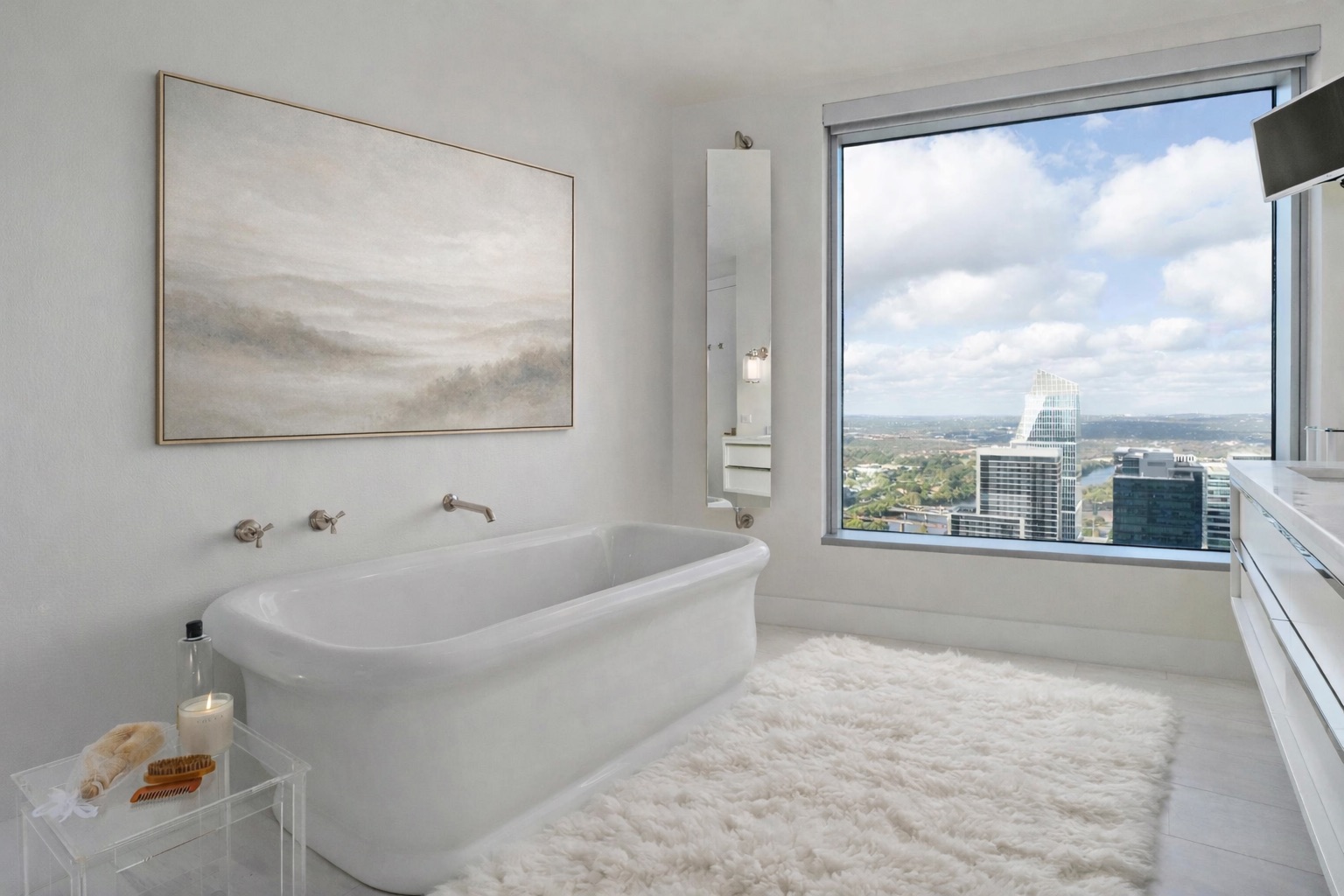 200 Congress Avenue, Unit 41Q Austin, TX 78701 - Photo 16 of 39 a bathroom with a tub and a view of bathroom