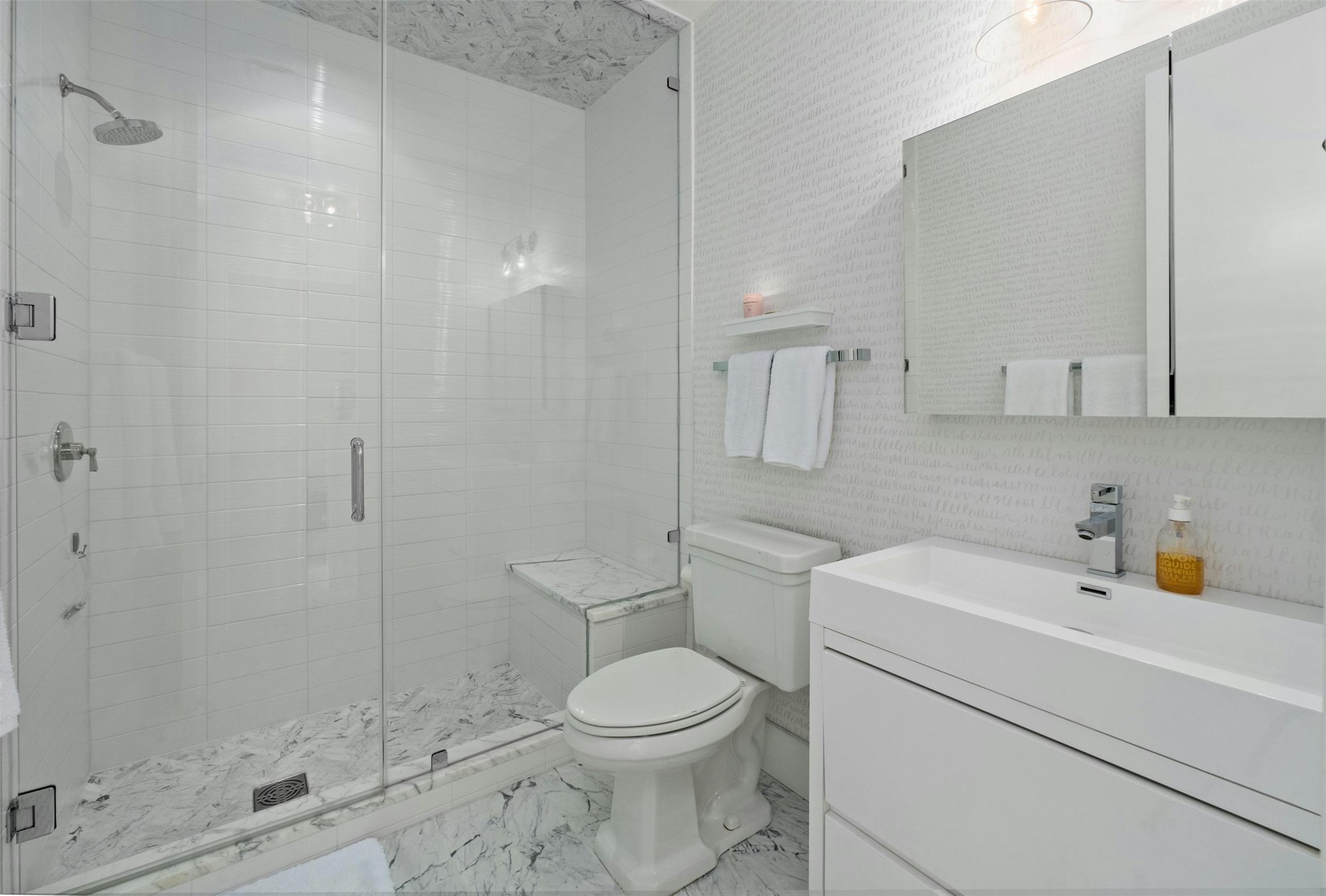 200 Congress Avenue, Unit 41Q Austin, TX 78701 - Photo 21 of 39 a bathroom with a sink a toilet and shower