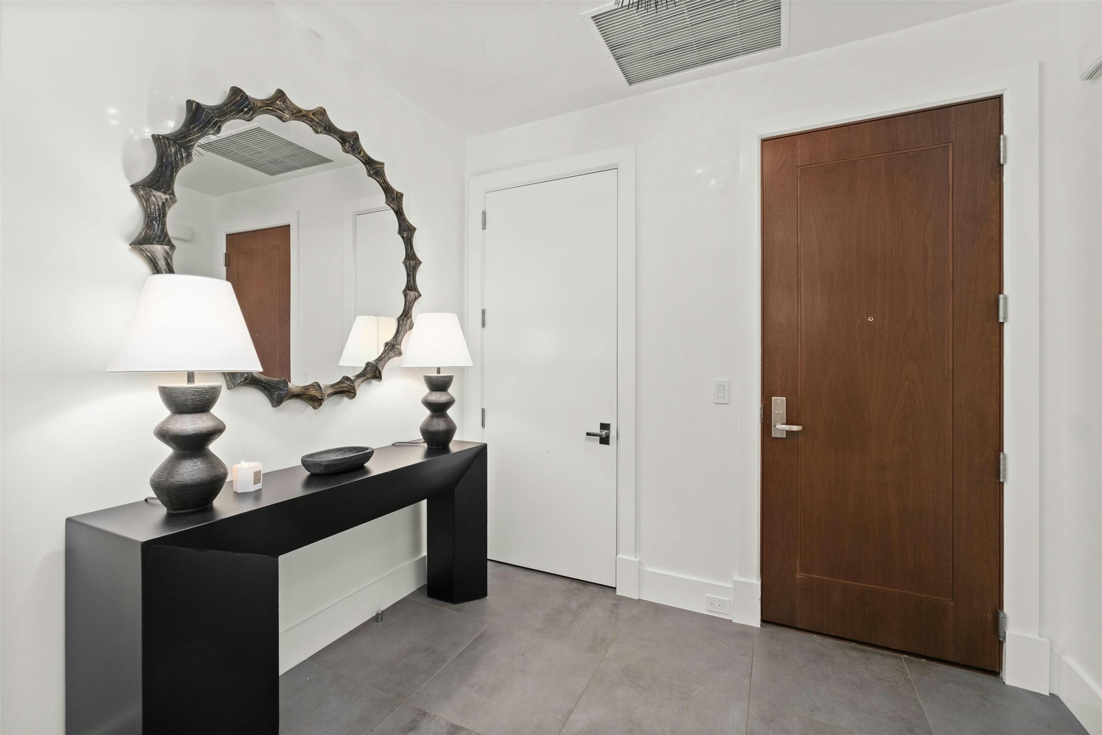 200 Congress Avenue, Unit 41Q Austin, TX 78701 - Photo 22 of 39 a living room with a table and a mirror