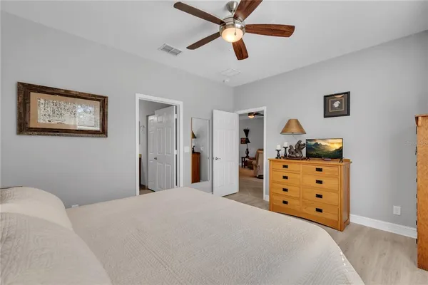 a bedroom with a bed and a dresser