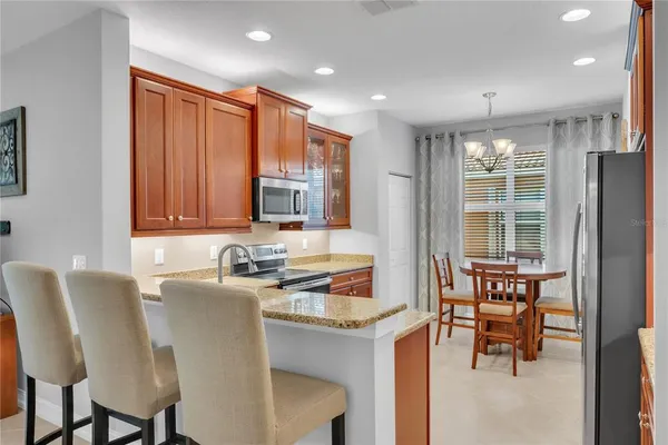 a dining room with furniture and window