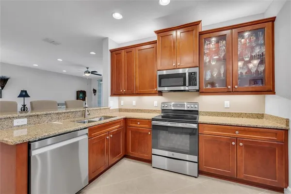 a kitchen with a sink stove and microwave