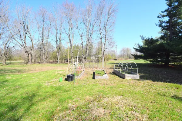 a view of a swimming pool with an outdoor space and seating area