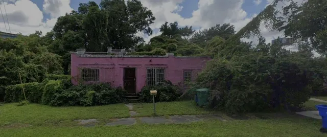 a view of a big yard in front of a house