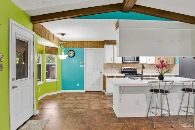 a workspace with furniture and a window