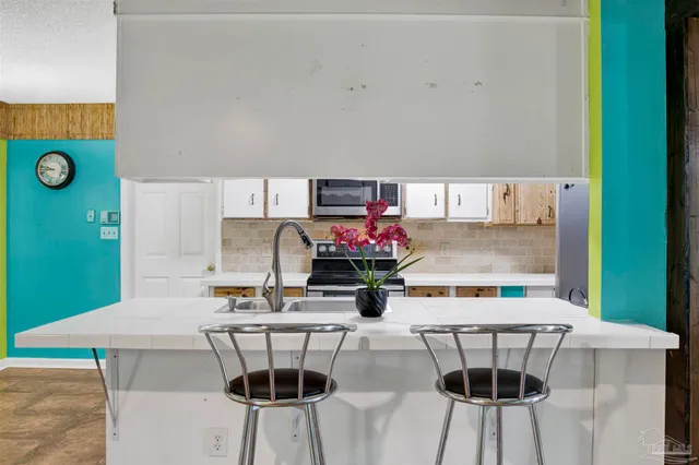 a living room with furniture and a table