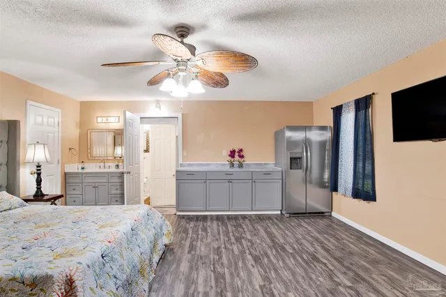 a bathroom with a sink toilet a shower and a mirror