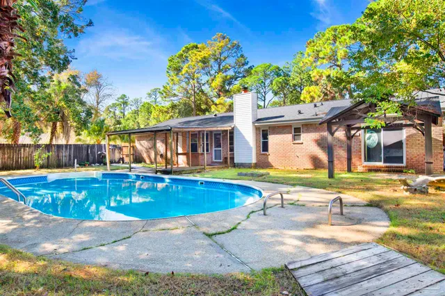 a view of a swimming pool with a patio