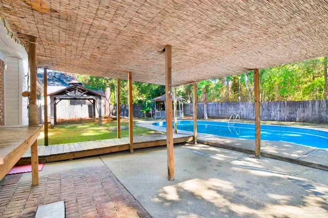 a view of swimming pool with a patio