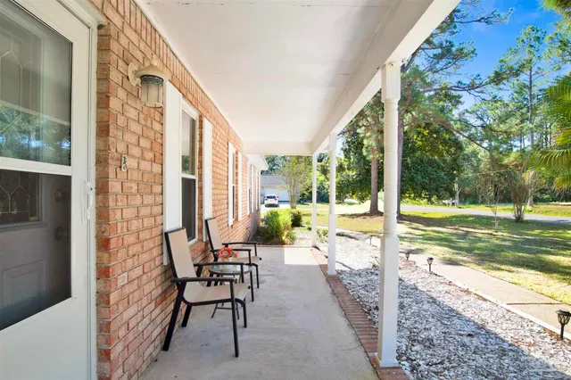 a view of swimming pool with outdoor seating