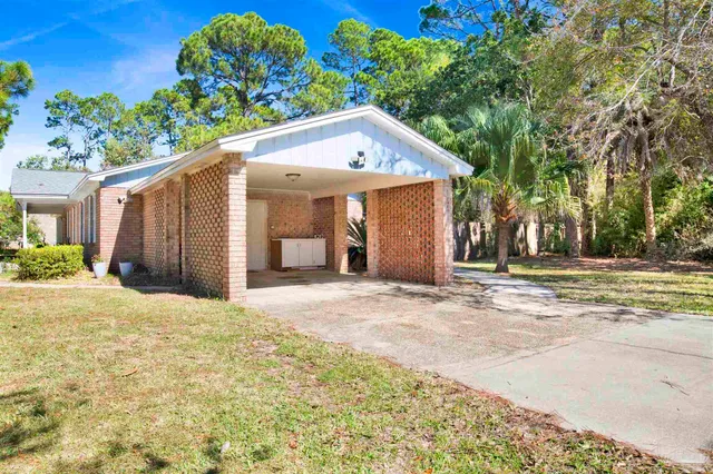 a house with trees in the background