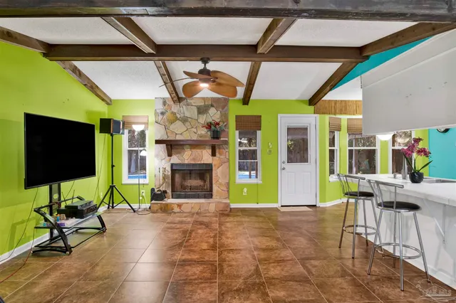 a view of a porch with furniture and a fireplace