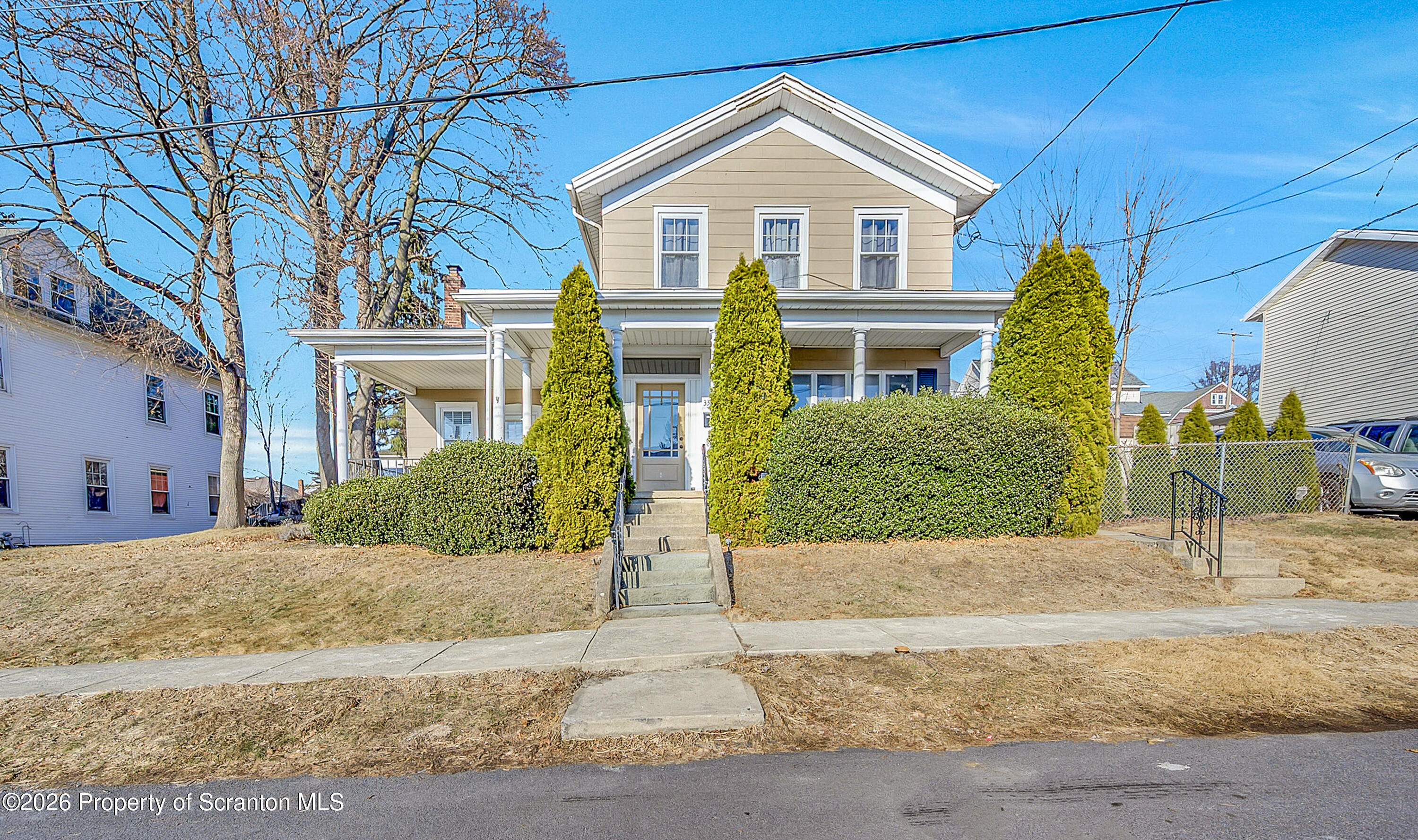 331 Cherry Street, Unit A Dunmore, PA 18512 - Photo 1 of 18 a front view of a house with garden
