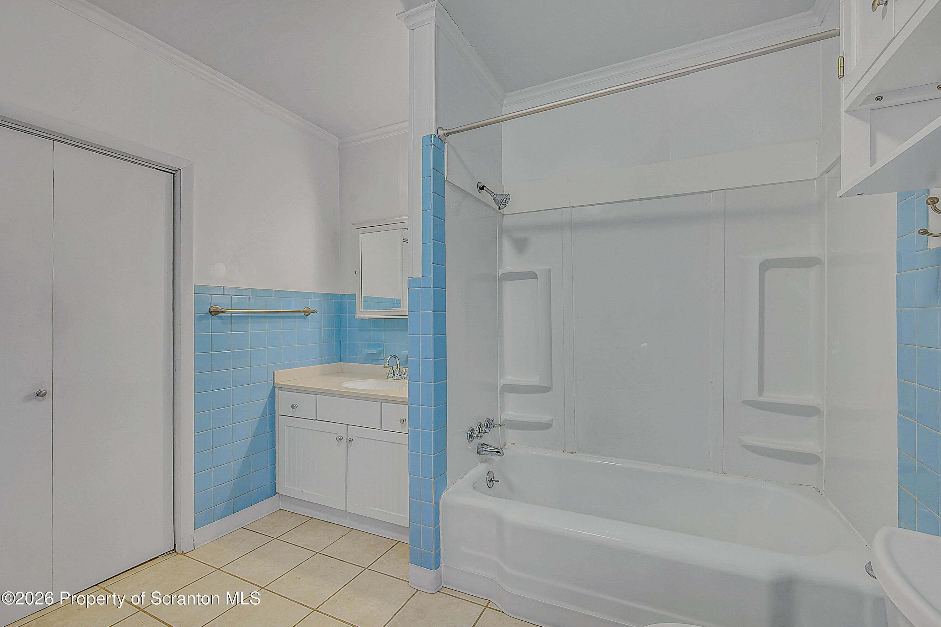 331 Cherry Street, Unit A Dunmore, PA 18512 - Photo 12 of 18 a bathroom with a tub toilet and sink