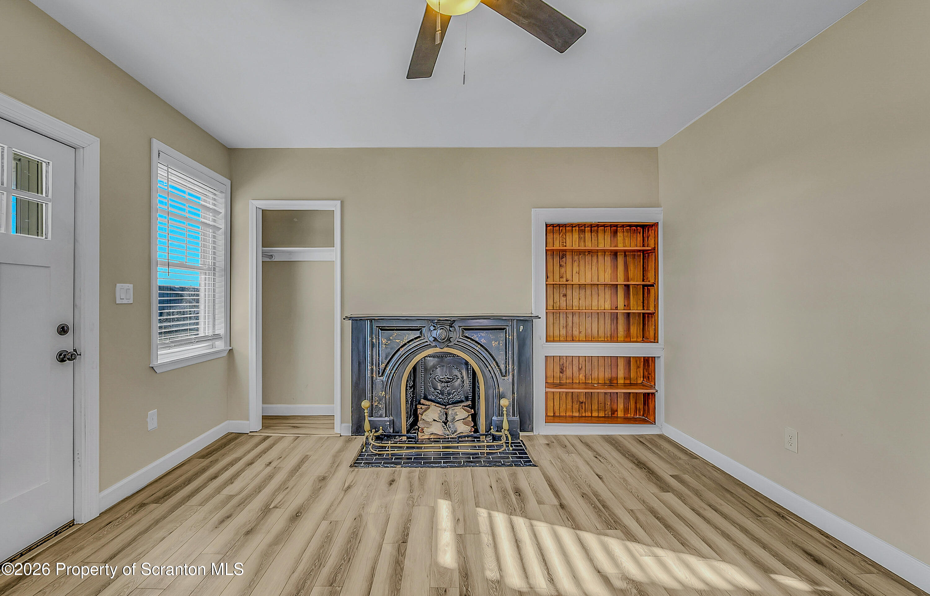 331 Cherry Street, Unit A Dunmore, PA 18512 - Photo 16 of 18 a view of empty room with wooden floor and fan