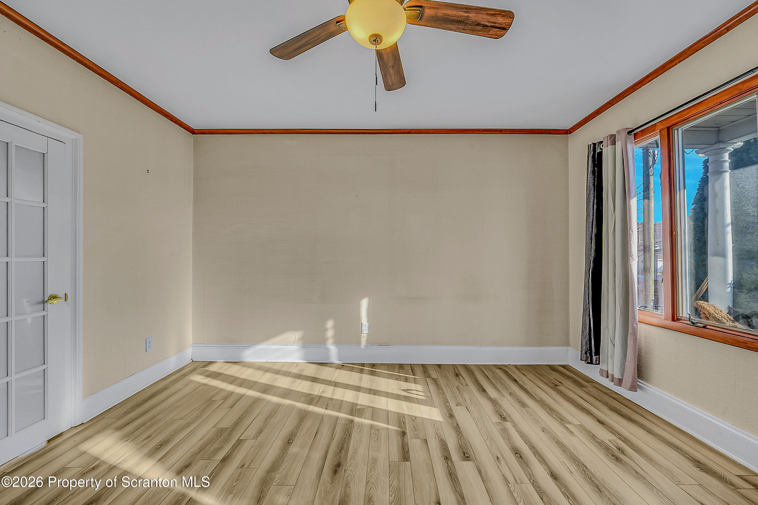 331 Cherry Street, Unit A Dunmore, PA 18512 - Photo 17 of 18 a view of empty room with wooden floor and fan