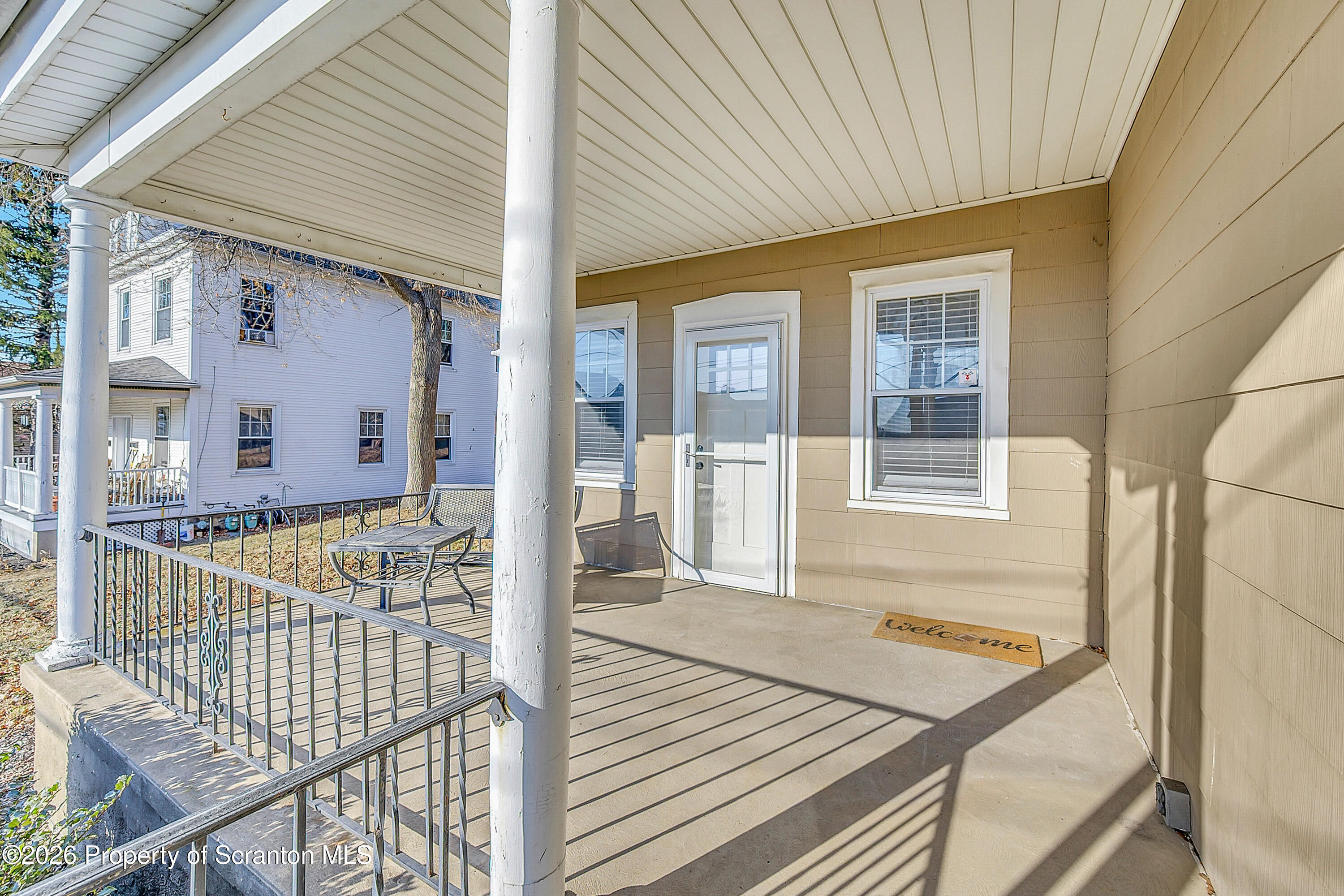 331 Cherry Street, Unit A Dunmore, PA 18512 - Photo 5 of 18 a view of a balcony with wooden floor