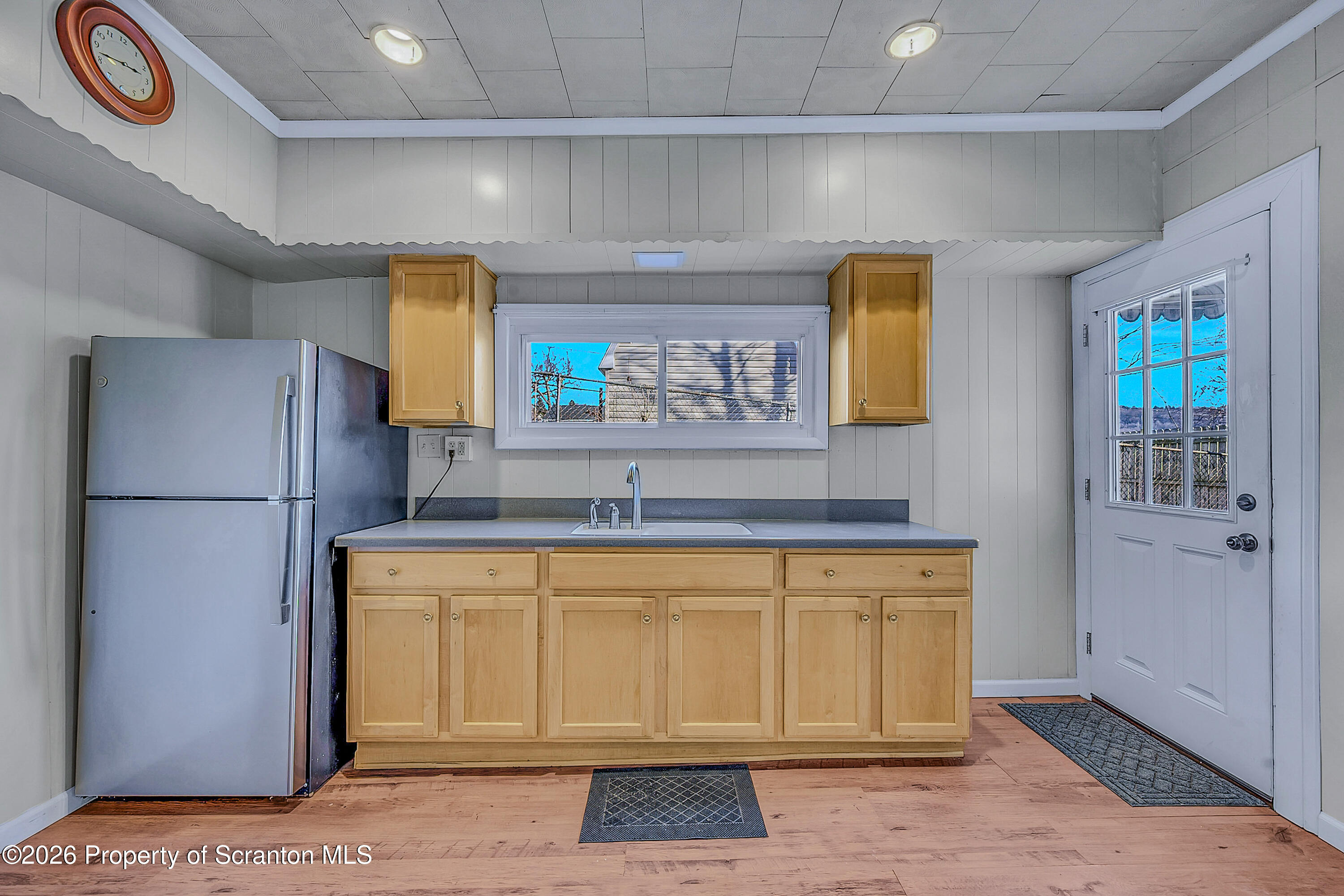331 Cherry Street, Unit A Dunmore, PA 18512 - Photo 6 of 18 a kitchen with a refrigerator and a sink