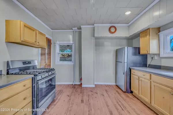an empty room with kitchen appliances and cabinets