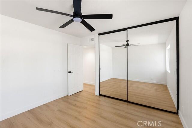 82151 Waring Way, Unit 33 Indio, CA 92201 - Photo 12 of 17 a view of empty room with wooden floor