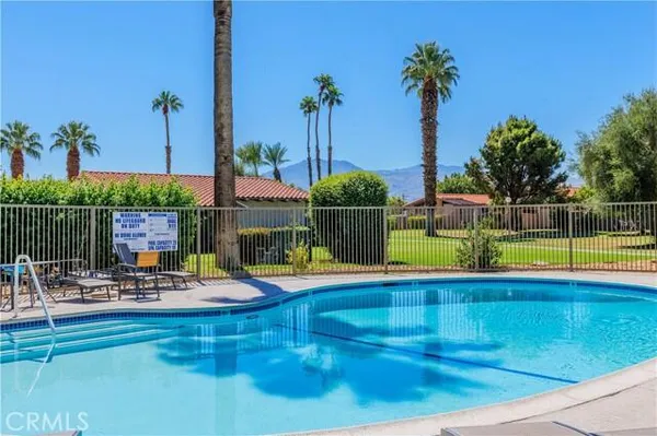 a view of a swimming pool with a patio