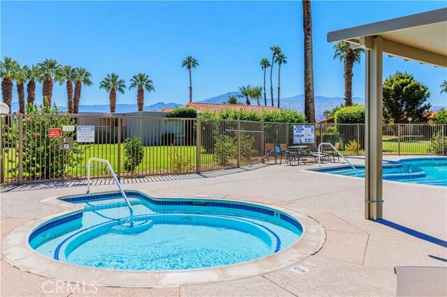 82151 Waring Way, Unit 33 Indio, CA 92201 - Photo 17 of 17 a view of a swimming pool with a patio