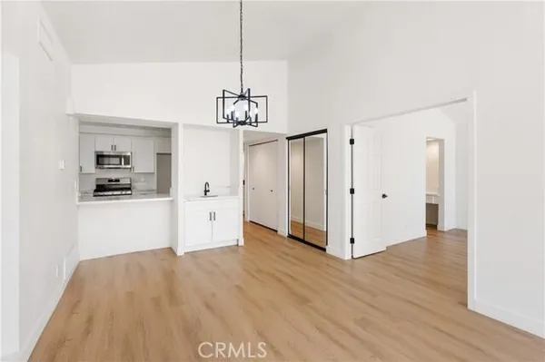 a view of a kitchen with cabinet and a ceiling fan