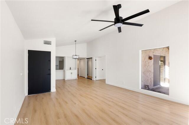 82151 Waring Way, Unit 33 Indio, CA 92201 - Photo 4 of 17 a view of a kitchen with a refrigerator and a sink