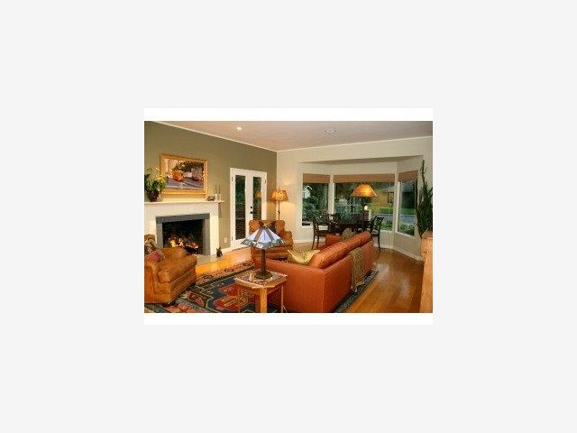 31 Rittenhouse Avenue Atherton, CA 94027 - Photo 2 of 9 a living room with furniture and a fireplace