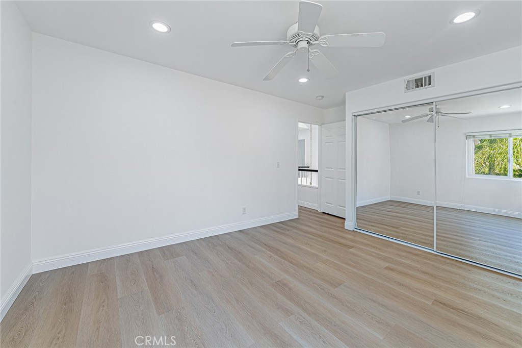 25533 Longfellow Place Stevenson Ranch, CA 91381 - Photo 30 of 47 wooden floor in an empty room with a window