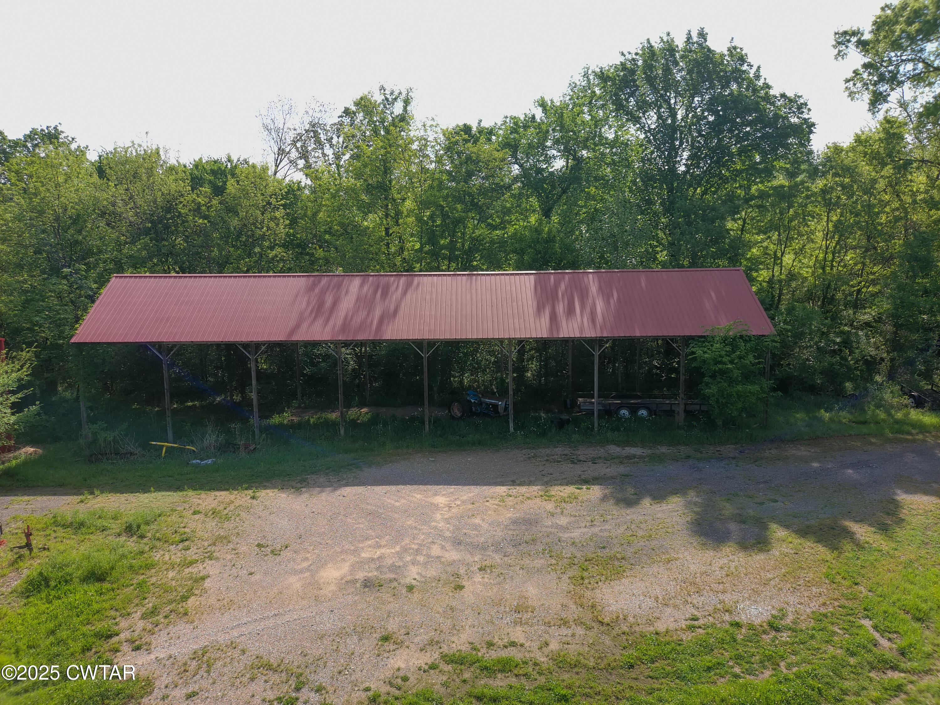 330 Archibald Road Stanton, TN 38069 - Photo 5 of 22 a backyard of a house with yard and outdoor seating
