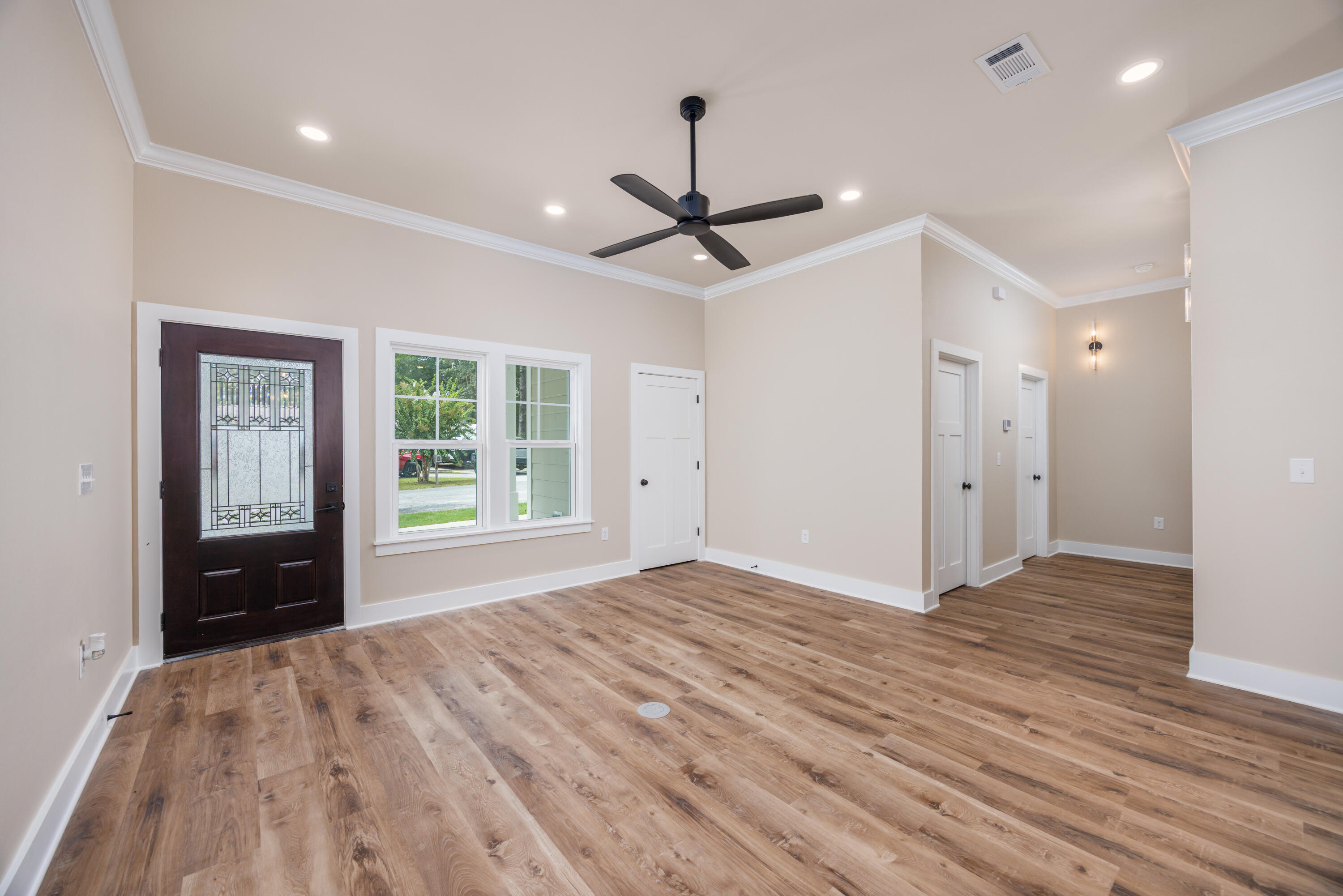 14 Shebbi Lane Freeport, FL 32439 - Photo 11 of 25 a view of empty room with wooden floor and fan