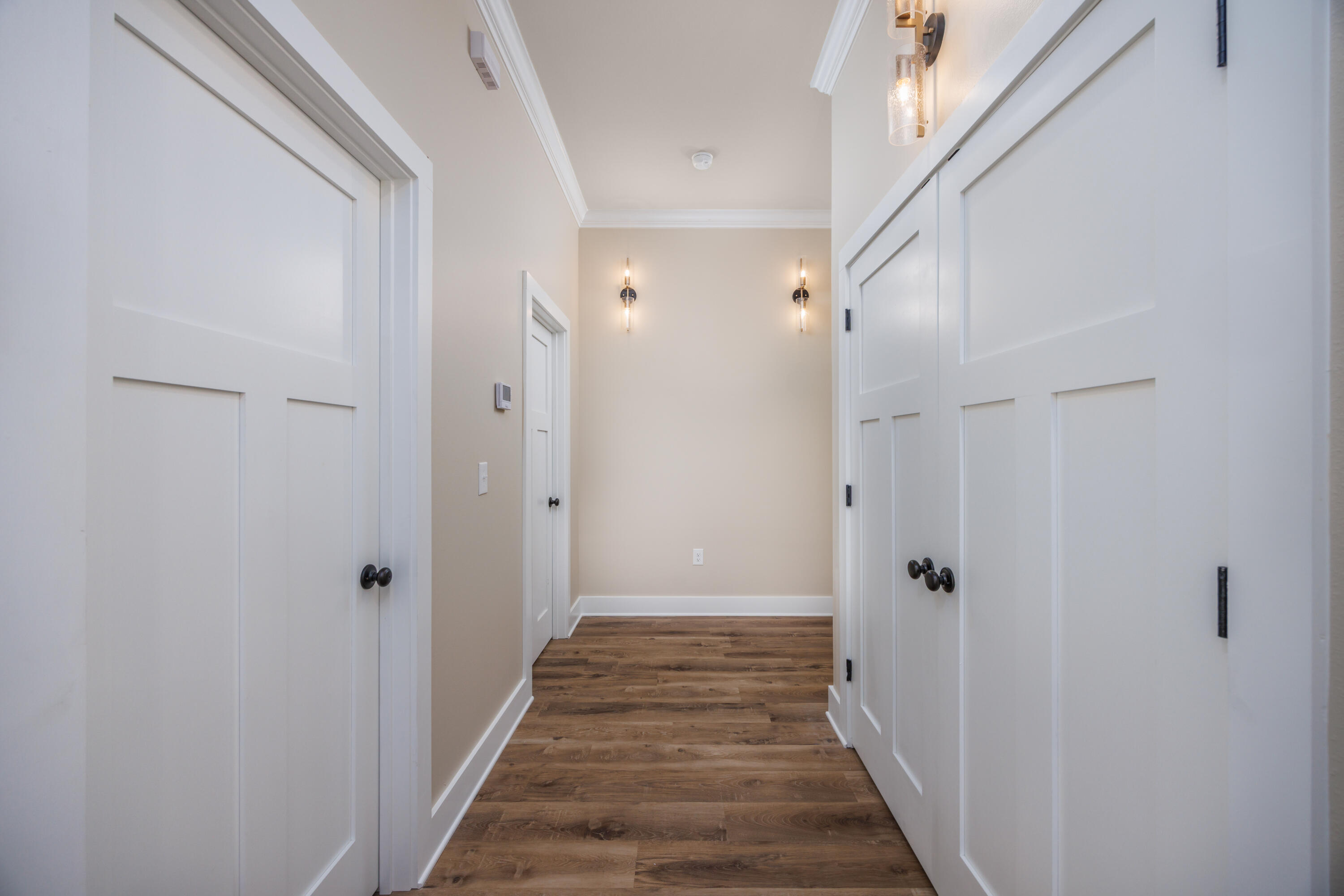 14 Shebbi Lane Freeport, FL 32439 - Photo 12 of 25 a view of a hallway with a wooden door