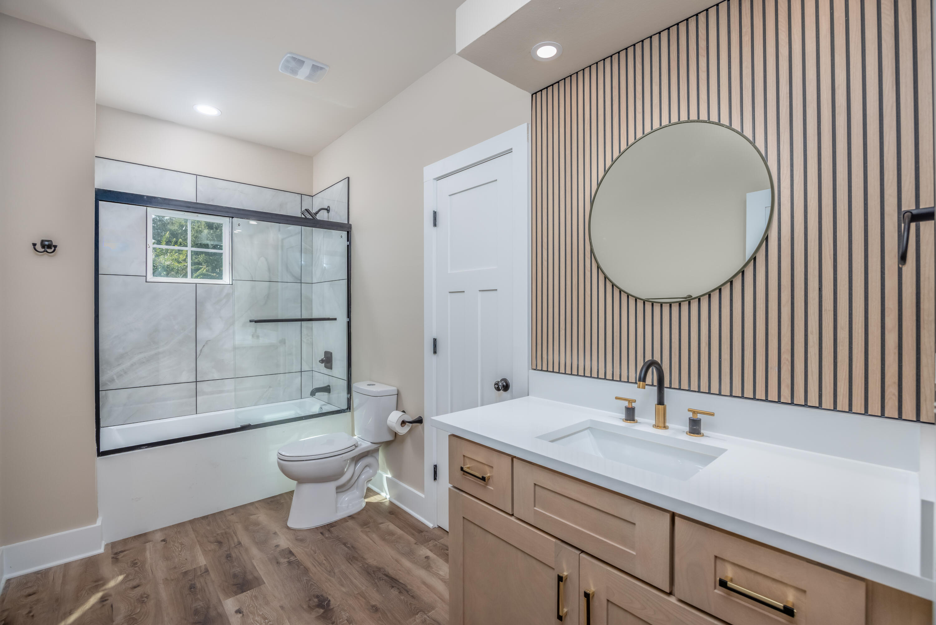 14 Shebbi Lane Freeport, FL 32439 - Photo 15 of 25 a spacious bathroom with a toilet a sink and a mirror