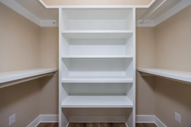 a close view of closet with wooden floor