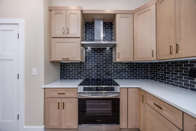 a kitchen with cabinets and appliances