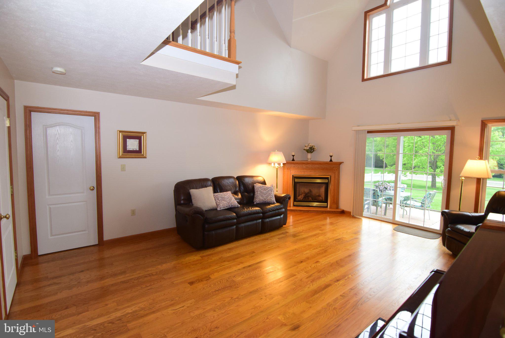 470 Millgate Road Bellefonte, PA 16823 - Photo 14 of 63 a living room with furniture and a fireplace