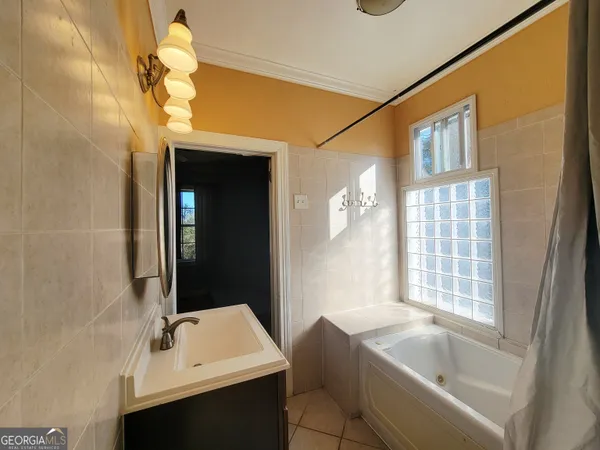 a bathroom with a sink and a bathtub
