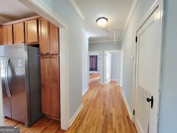 a view of a kitchen from the hallway