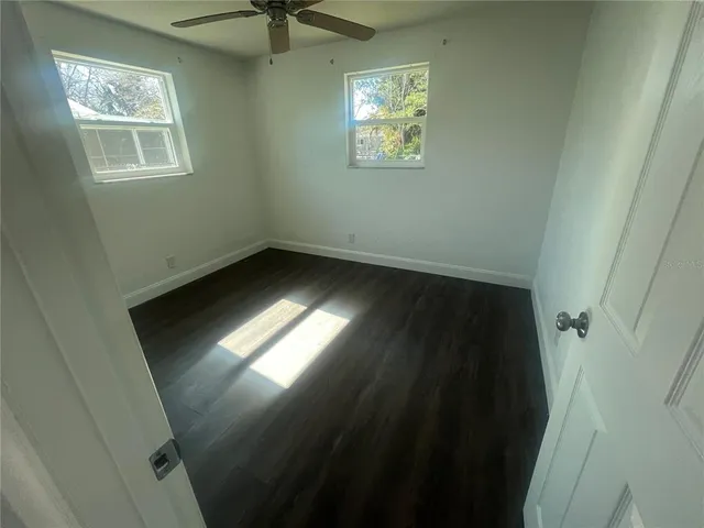 a view of an empty room and a window