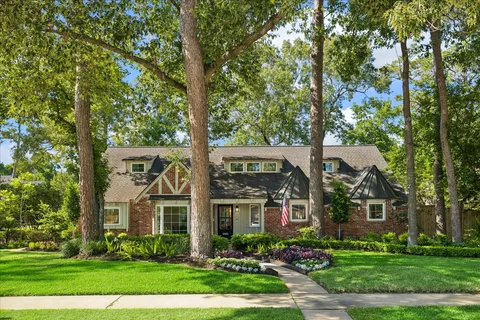 front view of a house with a garden
