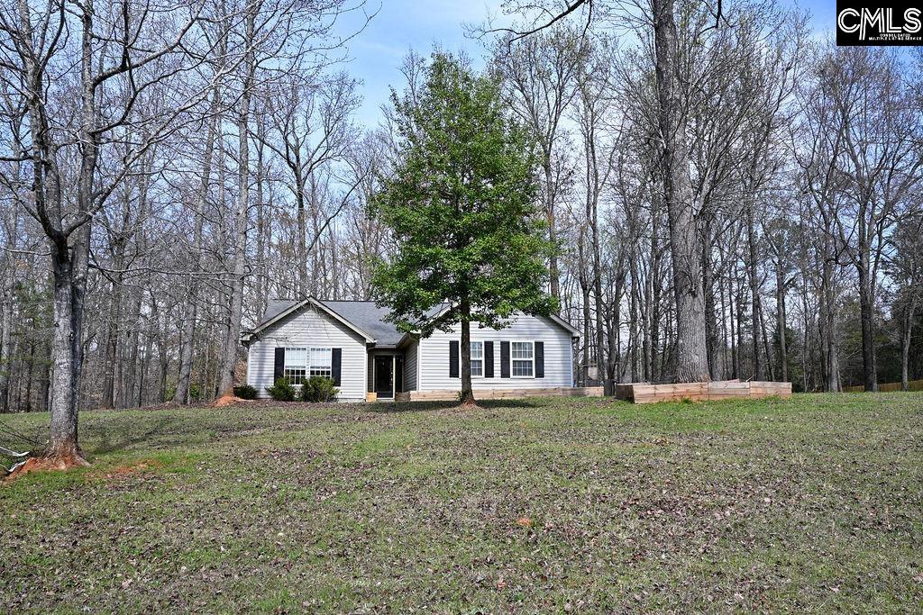 88 Running Deer Road Blythewood, SC 29016 - Photo 2 of 24 a front view of a house with a yard and trees