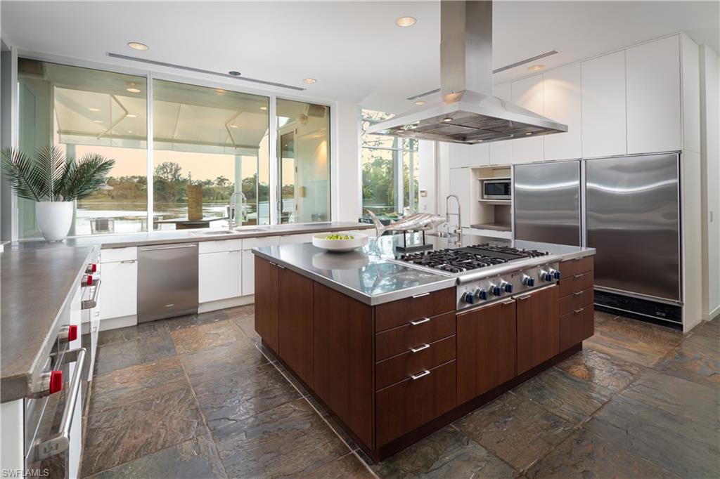 427 Ridge Court Naples, FL 34108 - Photo 12 of 49 a kitchen with a stove and a refrigerator